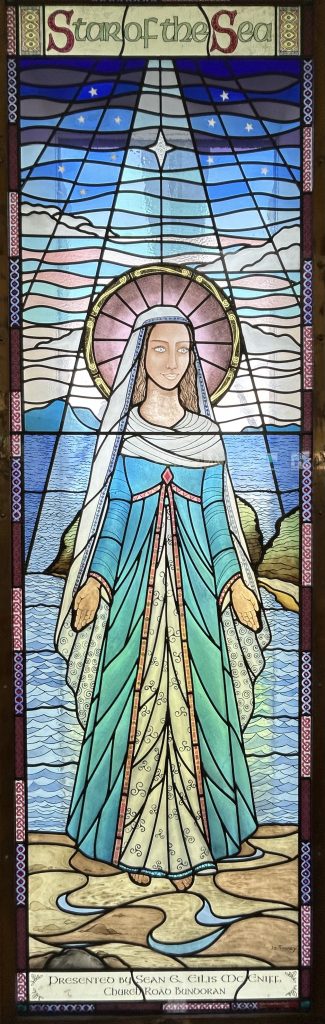 On the left hand side of the Rosary Chapel, a Stained Glass window created by Jo Tinney and made by Alpha Stained Glass Studio Derry, depicting Our Lady, Star of the Sea with Rougey Rocks, the Beach and Donegal Bay in the background. This window was installed in 2012. It was Unveiled and Blessed by Most Rev. Bishop Liam MacDaid DD Bishop of Clogher in September 2012. Presented by Sean & Eilis McEniff Church Road Bundoran.